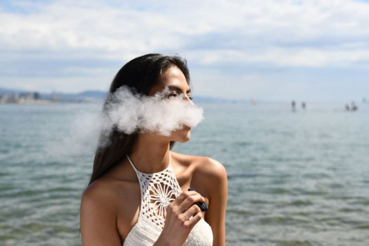 woman smoking vape